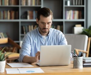 Focused,Business,Man,Sit,At,Workplace,Desk,At,Home,Office